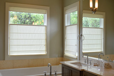 Large elegant master beige tile drop-in bathtub photo in Austin with an undermount sink, green walls and dark wood cabinets