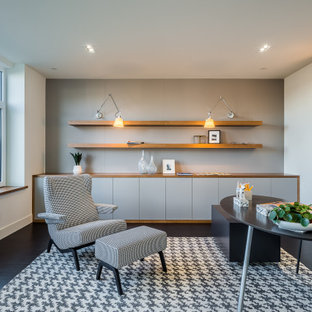 Design ideas for a contemporary study room in Seattle with white walls, painted wood floors, no fireplace, a freestanding desk and black floor.