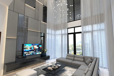 Cette image montre un grand salon design ouvert avec une salle de réception, un mur gris, un sol en marbre, un téléviseur indépendant et un sol beige.