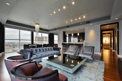 Living room - contemporary formal and open concept medium tone wood floor living room idea in Austin with gray walls