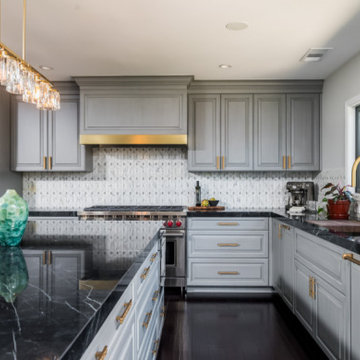 Luxurious Transitional Kitchen with Gold Accents and Black Marble Countertops