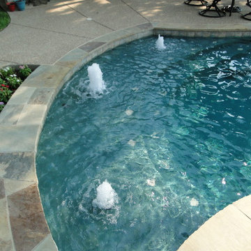 Freeform Pool, Arbor and Built in Grill with Limestone Bar
