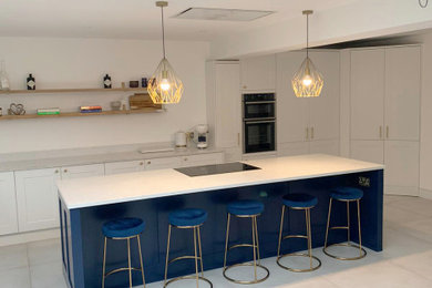 Traditional Kitchen with Navy Blue Island and White Natural Stone Effect Worktop