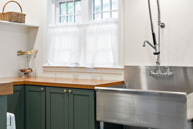Example of a transitional laundry room design in Wilmington