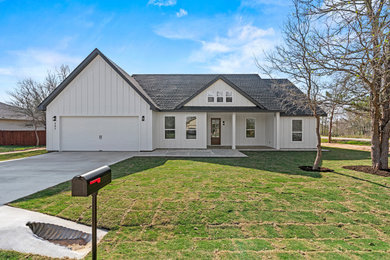 Example of a farmhouse exterior home design in Austin