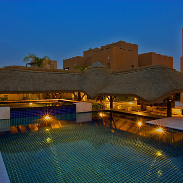 Thatch & timber is the is the focal point of this beautifully landscaped garden