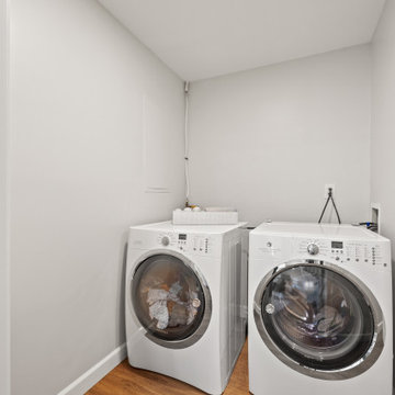 Tucked-Away Laundry Nook with Sloped Ceiling