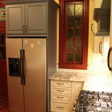 Traditional Galley Kitchen with Beige & Blue Cabinets and Chimney Hood