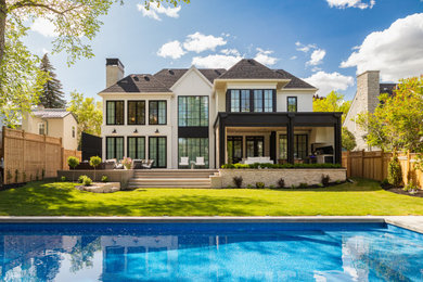 Inspiration for a classic house exterior in Calgary.