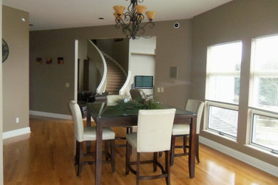 Example of a minimalist dining room design in Cleveland