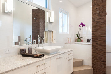 Inspiration for a mid-sized modern master white tile and glass tile porcelain tile, brown floor and single-sink bathroom remodel in Hawaii with flat-panel cabinets, white cabinets, a two-piece toilet, white walls, a vessel sink, quartz countertops and a floating vanity