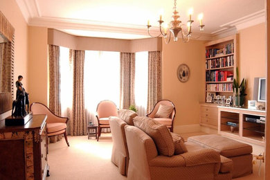 Photo of a large traditional formal open concept living room in London with carpet.