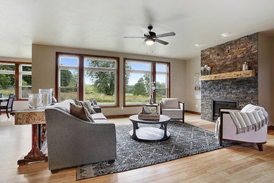 Large transitional formal and open concept light wood floor living room photo in Other with beige walls, no fireplace, a stone fireplace and no tv