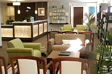 Example of a large zen formal and open concept medium tone wood floor and brown floor living room design with white walls, no fireplace and no tv