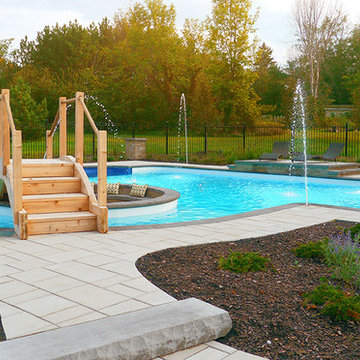 Pool with a firepit by Exact Landscapes