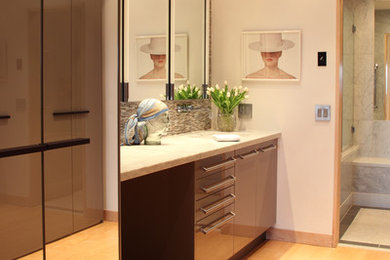 Large trendy master multicolored tile and pebble tile light wood floor bathroom photo in Seattle with flat-panel cabinets, a one-piece toilet and white walls