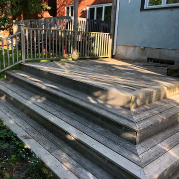 Red cedar deck with black round balusters