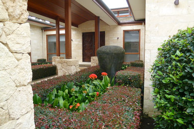 Small mediterranean front yard formal garden in Perth.