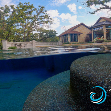 Southlake Reflective Vanishing Edge Pool with Perimeter Overflow Spa