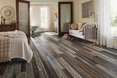 Example of a large transitional master dark wood floor and brown floor bedroom design in New York with beige walls and no fireplace
