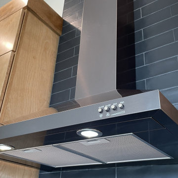 Angled Kitchen Design with Slab Style Cabinets in Pecan Stain