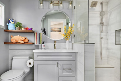 Photo of a small contemporary family bathroom in Dallas with shaker cabinets, grey cabinets, an alcove shower, white tiles, marble tiles, grey walls, marble flooring, a submerged sink, engineered stone worktops, white floors, a hinged door, white worktops, a shower bench, a single sink, a built in vanity unit and a vaulted ceiling.