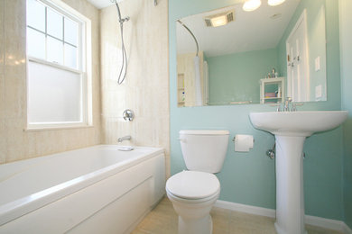 Example of a small transitional 3/4 beige tile and porcelain tile porcelain tile and beige floor bathroom design in Boston with a two-piece toilet, blue walls and a pedestal sink