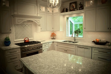 Example of a classic medium tone wood floor eat-in kitchen design in Chicago with an undermount sink, recessed-panel cabinets, white cabinets, quartzite countertops, white backsplash, porcelain backsplash, stainless steel appliances and an island