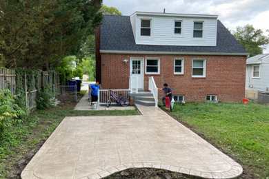 Mid-sized backyard concrete patio photo in DC Metro with no cover