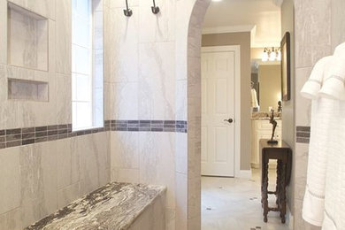 Example of a large classic master gray tile and porcelain tile mosaic tile floor bathroom design in Charlotte with gray walls