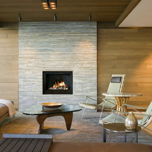 Example of a mid-sized trendy open concept beige floor living room design in Los Angeles with beige walls, a standard fireplace, a tile fireplace and no tv