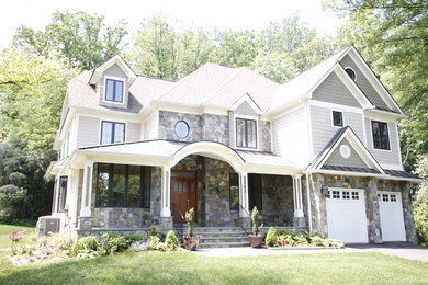 Large transitional gray two-story mixed siding house exterior photo in DC Metro with a hip roof and a shingle roof