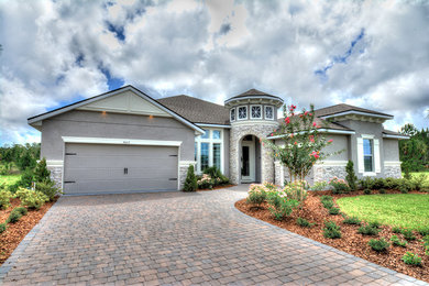 Example of a tuscan home design design in Orlando