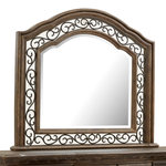 Magnussen - Magnussen Durango Shaped Mirror in Willadeene Brown - Traditional by nature, the handsome Durango bedroom collection imparts fresh allure to a classically inspired design aesthetic. Rooted in old world styling, these timeless silhouettes feature intricate carvings, fluted pilasters and ornate scrollwork insets. Antique Brass hardware gives the room a warm metallic element while providing the perfect complement to Durango's gorgeous Willadeene Brown finish. If you're an admirer of traditional styling, this statement bed and coordinating storage pieces are a must-have.