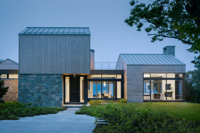 Mid-sized beach style two-story wood and shingle exterior home photo in Portland Maine with a metal roof and a gray roof
