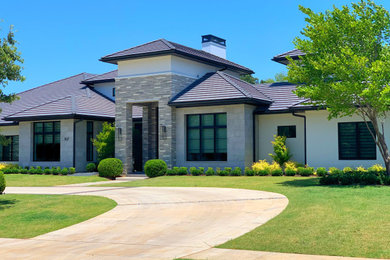 Inspiration for a modern white one-story exterior home remodel in Dallas with a hip roof and a tile roof