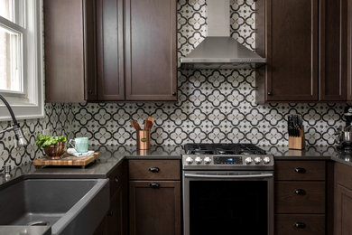 Inspiration for a small timeless u-shaped dark wood floor enclosed kitchen remodel in Chicago with a farmhouse sink, shaker cabinets, dark wood cabinets, quartz countertops, ceramic backsplash, stainless steel appliances, no island and gray countertops