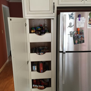 Pantry cabinet with roll out shelves