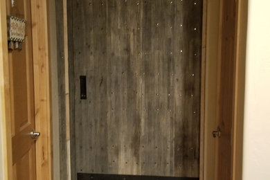 Inspiration for a small contemporary guest porcelain tile and brown floor bedroom remodel in Denver with yellow walls