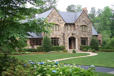Design ideas for a huge traditional full sun front yard driveway in Atlanta.