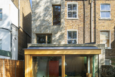 Example of a transitional exterior home design in London