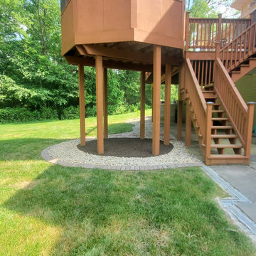 Brick line creation with decorative rock, French drain & rubber mulch placement.