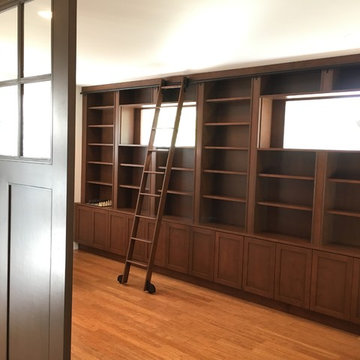 Barn doors with bookcase and sliding ladder
