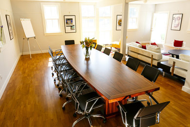 Dining room - large 1950s medium tone wood floor and brown floor dining room idea in Other with white walls and no fireplace