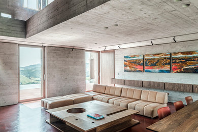 Inspiration for a large modern formal open concept living room in Other with concrete floors, a built-in media wall, red floor and grey walls.