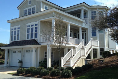 Inspiration for a huge coastal beige three-story wood gable roof remodel in Other
