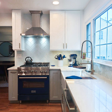 Bright Galley Kitchen with Blue ZLINE Range and Stainless Hood