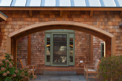 Inspiration for a contemporary wood exterior home remodel in Other