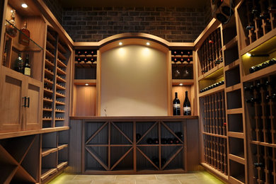 Inspiration for a large transitional porcelain tile wine cellar remodel in Portland