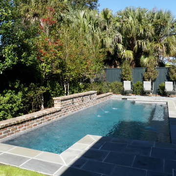 Pool, waterfall, and landscaping